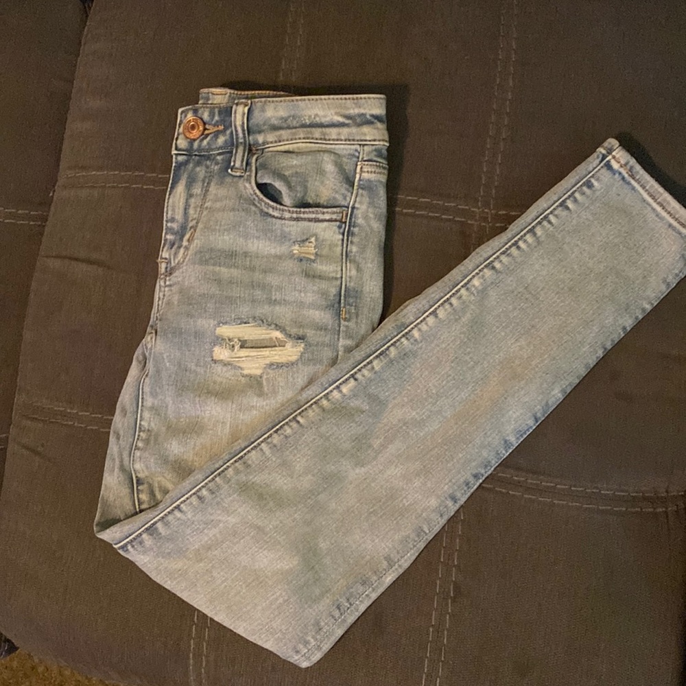 Brand American Eagle, size 00, light blue ripped skinny jeans.